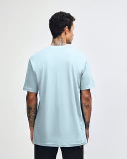 A light blue unisex short sleeve t-shirt viewed from the back, featuring a subtle logo on the upper back.
