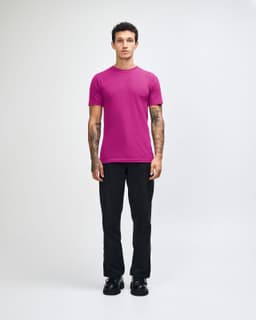 A unisex fine jersey short sleeve t-shirt in vibrant magenta, featuring a brand logo.