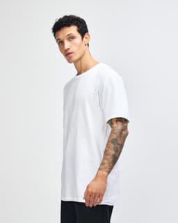 A white unisex fine jersey short sleeve t-shirt displayed on a model from the side. The shirt has a logo.