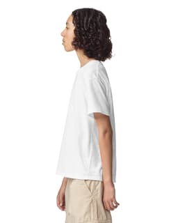 A side view of a plain white youth T-shirt with a relaxed fit, featuring a small logo.