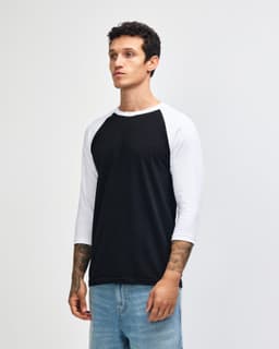 A black and white unisex raglan T-shirt featuring a logo. The shirt has three-quarter sleeves and a round neckline.
