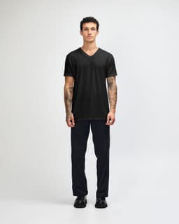 A black unisex V-neck T-shirt displayed on a model, featuring short sleeves and a fitted style.