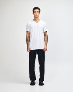 A white unisex V-neck T-shirt displayed on a model, featuring short sleeves and a logo.