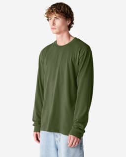 A long sleeve t-shirt in olive green, featuring a round neck and a logo. The model stands against a white backdrop.