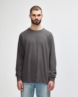 A grey long sleeve T-shirt featuring a round neck and a brand logo on the label.