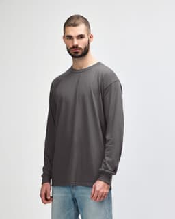 A grey long sleeve t-shirt designed for adults, featuring a crew neck and a simple, unadorned style.