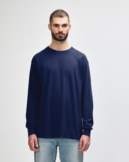 A long sleeve t-shirt in navy blue, featuring a simple design and a logo on the front.