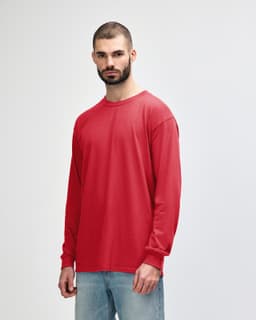A red long sleeve T-shirt with a round neckline and a logo on the front, displayed on a model.