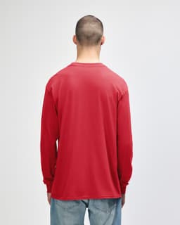 A long sleeve T-shirt in bright red, featuring a plain back and a casual fit. The model is facing away from the camera.