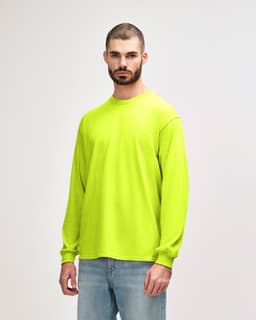 A bright yellow long sleeve T-shirt displayed on a model. The shirt features a logo or branding.