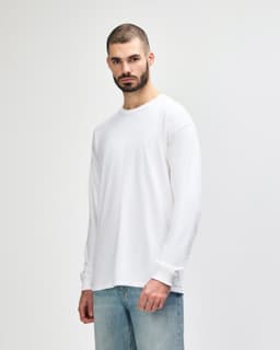 A white long sleeve T-shirt for adults, featuring a simple design and a logo on the front.