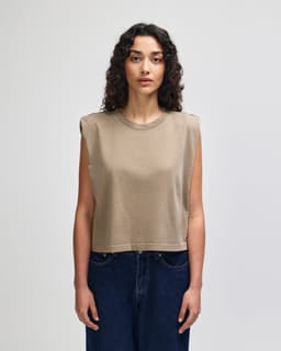 A women's muscle t-shirt in a brown hue, featuring a sleeveless design and a relaxed fit.