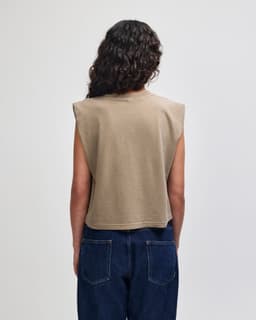 A cropped muscle t-shirt in a muted brown colour, featuring sleeveless design and a simple back view.