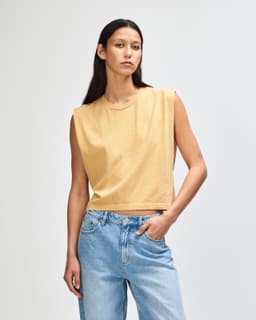 A women's muscle T-shirt in a sandy beige colour, featuring a simple design and no sleeves.
