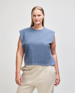 A women's muscle t-shirt in a deep blue shade, featuring a round neckline and a loose fit.