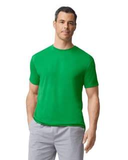 A man wearing a bright green Gildan Performance adult T-shirt and light grey shorts. The T-shirt has a logo.