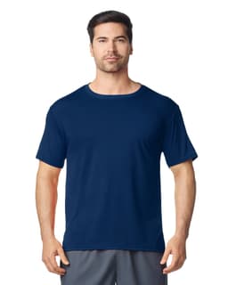 A navy Gildan Performance adult t-shirt displayed on a male model, featuring a round neckline and short sleeves.