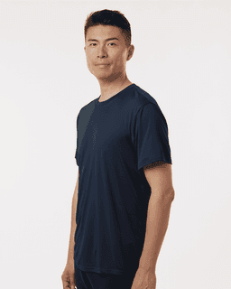 A man wearing a navy men's performance T-shirt, featuring a relaxed fit and minimal design.