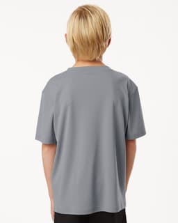 A grey youth t-shirt featuring a simple design and a logo on the back.