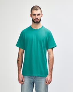 A turquoise Gildan Heavy Cotton adult T-shirt displayed on a model, featuring a round neck and short sleeves.