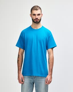 A turquoise Gildan Heavy Cotton adult T-shirt displayed on a male model against a plain background.