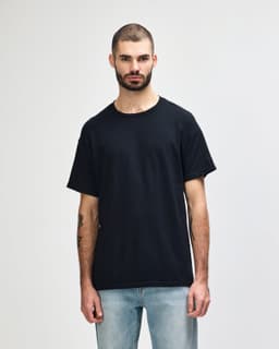 A black Gildan Heavy Cotton adult T-shirt displayed on a model against a plain background.