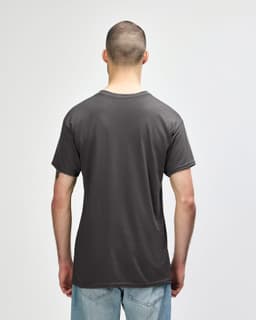 A grey Gildan Heavy Cotton Adult T-Shirt, viewed from the back, featuring a simple design and a logo.