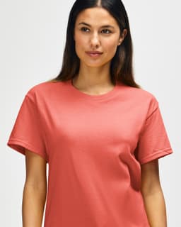 A coral Gildan Heavy Cotton Adult T-Shirt on a mannequin, featuring a round neckline and short sleeves.