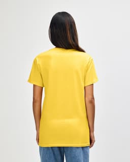 A yellow Gildan Heavy Cotton adult T-shirt viewed from the back, featuring a plain design and short sleeves.