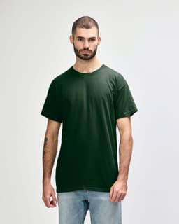 A green Gildan Heavy Cotton Adult T-Shirt displayed on a male model, featuring a simple design with a logo.