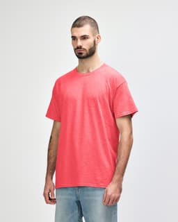 A red Gildan Heavy Cotton Adult T-Shirt displayed on a model, featuring a simple design and a casual fit.