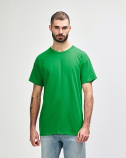 A green Gildan Heavy Cotton Adult T-Shirt displayed on a model against a neutral background.