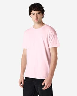 A pink Gildan Heavy Cotton Adult T-Shirt displayed on a model, featuring short sleeves and a relaxed fit.
