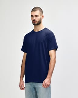 A navy adult T-shirt displayed on a model, featuring a basic design and a logo on the sleeve.
