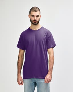A purple Gildan Heavy Cotton Adult T-Shirt displayed on a model, featuring a plain design and a logo.