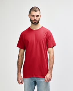 A red Gildan Heavy Cotton adult t-shirt displayed on a model. The shirt has a logo branding.