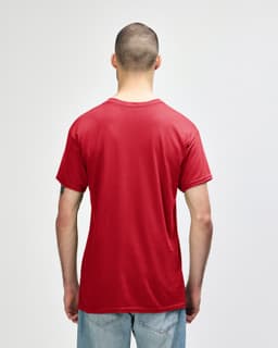 A red Gildan Heavy Cotton adult T-shirt displayed from the back on a model wearing black pants.
