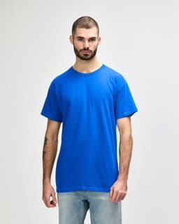 A blue Gildan Heavy Cotton Adult T-Shirt on a male model, featuring short sleeves and a relaxed fit.