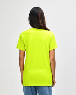 A man wearing a bright yellow Gildan Heavy Cotton adult T-shirt viewed from the back. The shirt has a logo.