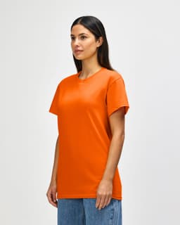 An orange adult t-shirt displayed on a model, featuring a round neckline and short sleeves. It has a logo.