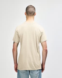 A beige Gildan Heavy Cotton adult T-shirt displayed from the back, featuring a simple design and short sleeves.