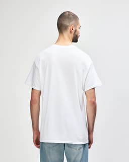 A white Gildan Heavy Cotton adult t-shirt displayed from the back, featuring a standard fit and short sleeves.