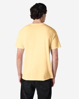 A plain yellow Gildan Heavy Cotton adult T-shirt viewed from the back, featuring a casual fit.
