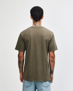 A sueded unisex short sleeve T-shirt in olive green, featuring a logo on the back.