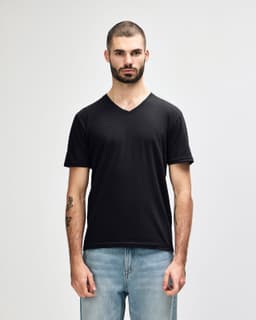 A black Gildan Softstyle adult v-neck t-shirt displayed on a model. The shirt features a branding logo.