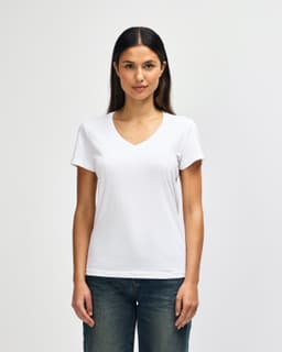 A white ladies' V-neck t-shirt displayed on a model, featuring a comfortable fit and short sleeves.