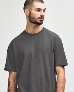 A midweight adult t-shirt in olive green, featuring a simple design and short sleeves. It has a logo on it.