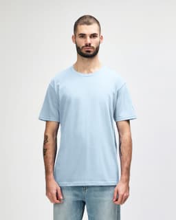 A light blue midweight T-shirt on a male model, featuring a crew neck and short sleeves. It includes a logo on the side.