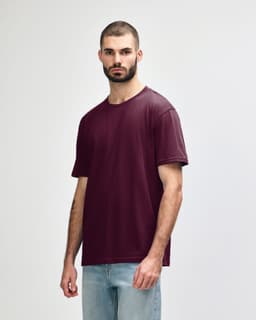 A burgundy Gildan Softstyle Adult Midweight T-Shirt displayed on a model, featuring a branding logo.