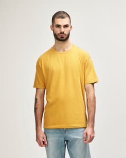 A midweight adult t-shirt in mustard yellow with a fitted style, featuring a logo.